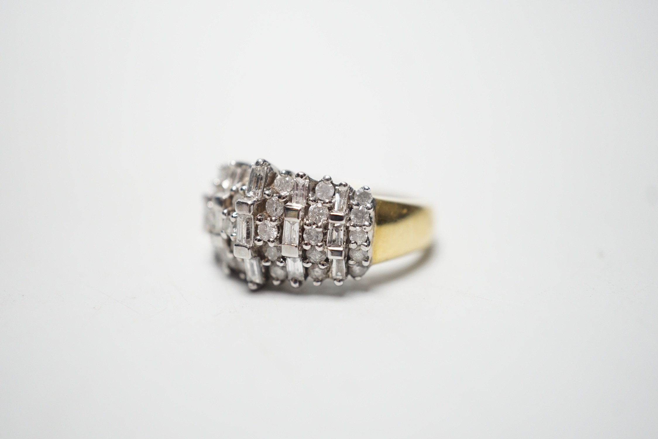 A modern yellow metal, round and baguette cut diamond set half hoop cluster ring, size L/M, gross - Image 2 of 4