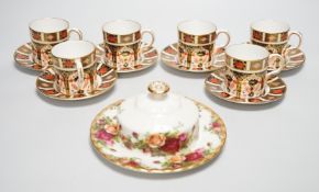 Six Royal Crown Derby coffee cans and saucers and a Royal Albert Country Roses dish and cover