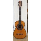 A 19th century Spanish parlour guitar labelled Antonio Carlos Garcia, Madrid. The back 46.5cm