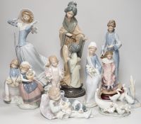 Seven Lladro and two Nao porcelain figures together with another, stuck to base so mark can’t be