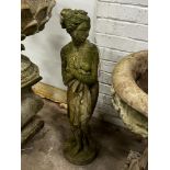 A reconstituted stone female bather garden ornament, height 80cm