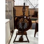 A 19th century turned wood oak spinning wheel, height 98cm