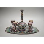 A decorative Persian enamel on copper set on stand. Tallest piece 20cm
