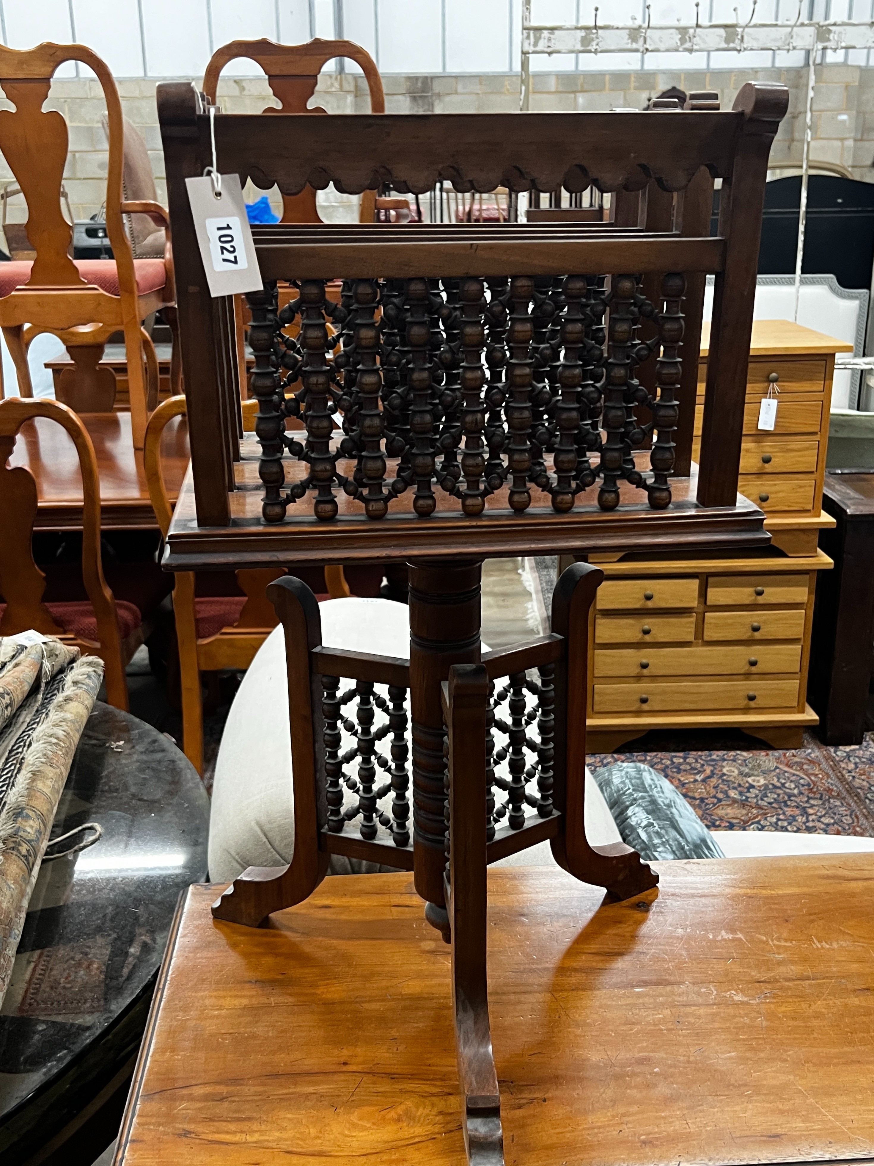 An early 20th century Moorish style walnut three division revolving newspaper stand, width 42cm, - Image 2 of 2