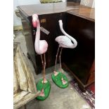 A pair of flamingo garden ornaments, larger height 103cm