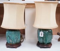 A pair of Chinese blue glazed earthenware hexagonal vase lamps on wooden mounts, with their