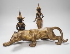 Two two colour Thai patinated metal figures and a hollow cast leopard. Tallest 25cm