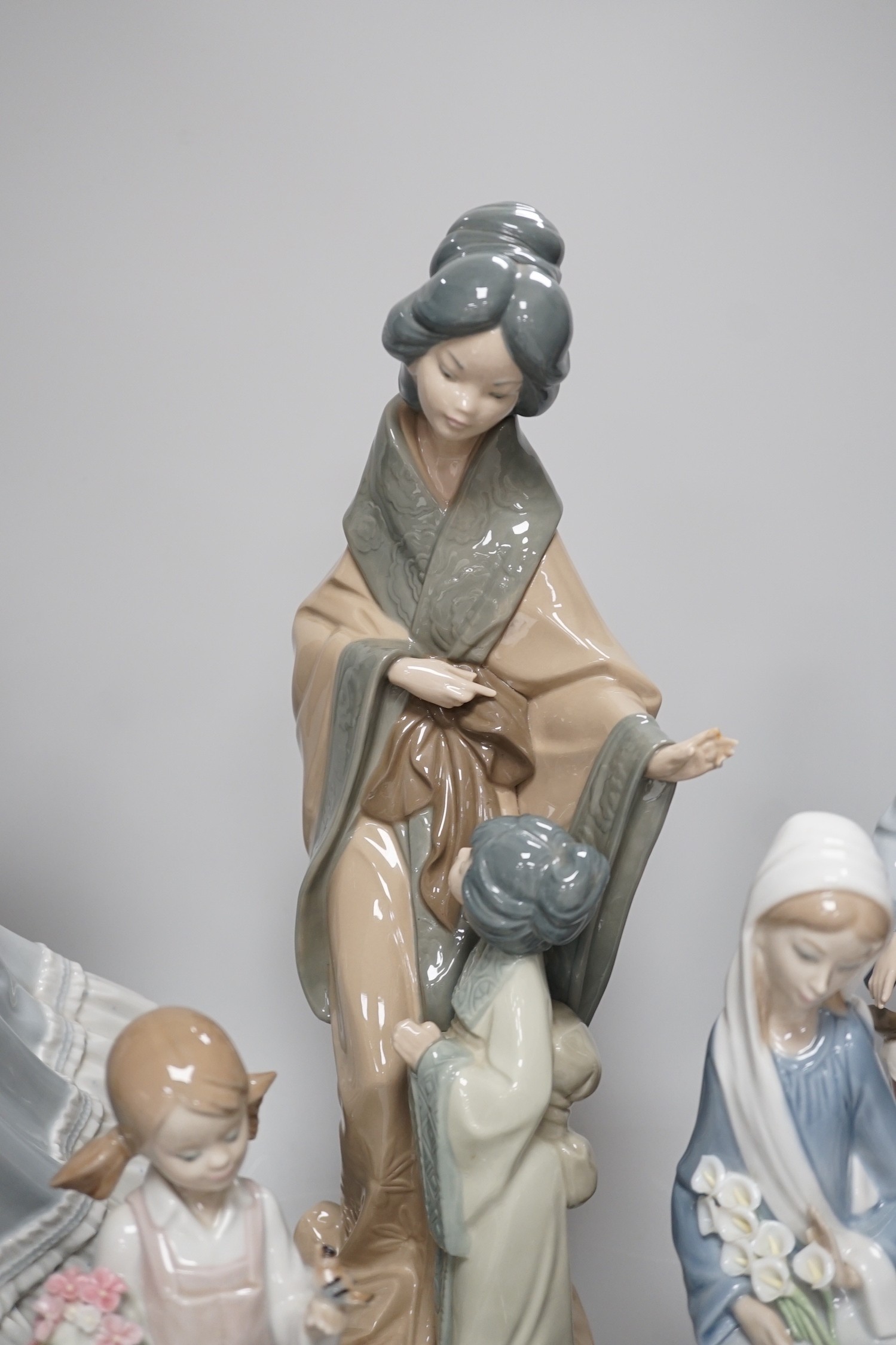 Seven Lladro and two Nao porcelain figures together with another, stuck to base so mark can’t be - Image 9 of 9