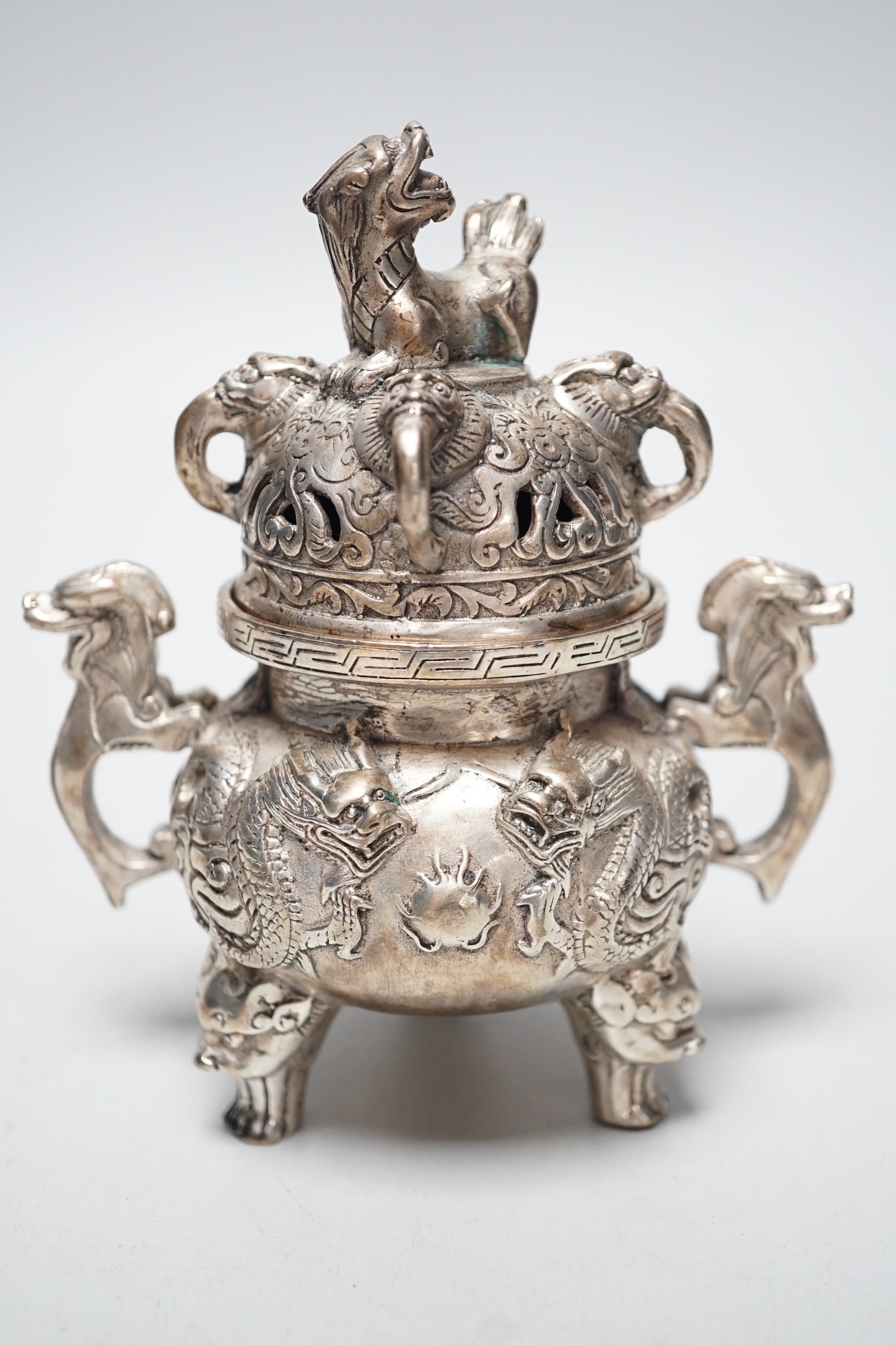 A Chinese cast metal censer and cover, seal mark to base. 13cm tall