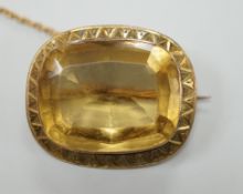 A yellow metal mounted cushion cut citrine set brooch, 27mm, gross weight 6.9 grams.