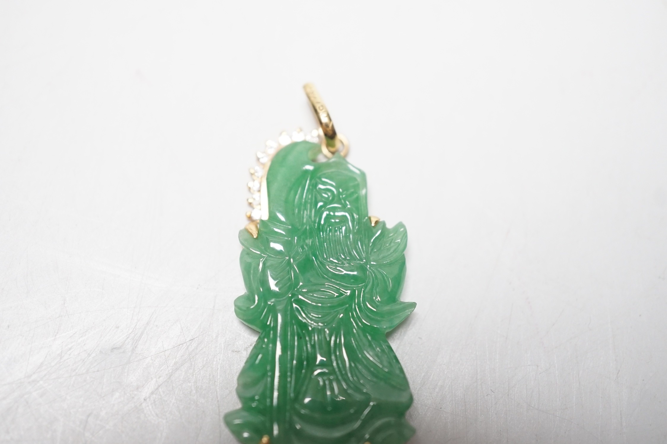 A modern 18k and diamond chip mounted jadeite pendant, carved as an immortal, 40mm, gross weight 9.1 - Image 2 of 4