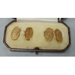 A pair of George V 9ct. gold oval cuff links, with engraved monograms, cased, 4.3 grams.