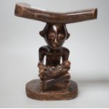 An African tribal carved wood fertility figure headrest, possibly Songye,. 24cm tall