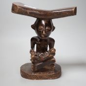 An African tribal carved wood fertility figure headrest, possibly Songye,. 24cm tall