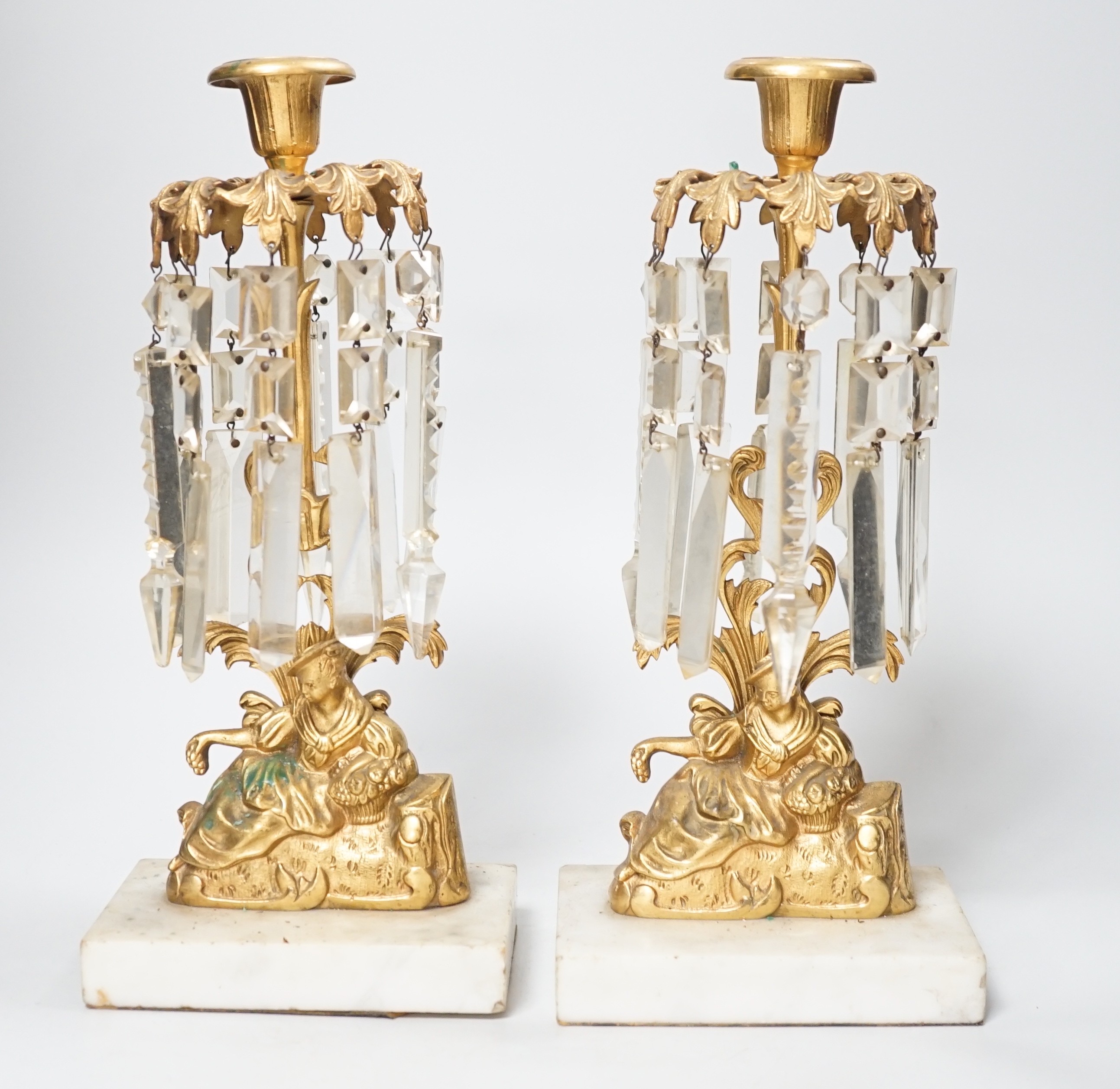 A pair of figural gilt metal table candlestick lustres on marble bases. 30cm tall