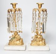 A pair of figural gilt metal table candlestick lustres on marble bases. 30cm tall