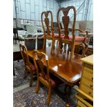 A reproduction Queen Anne style banded cherry twin pillar extending dining table, length 240cm