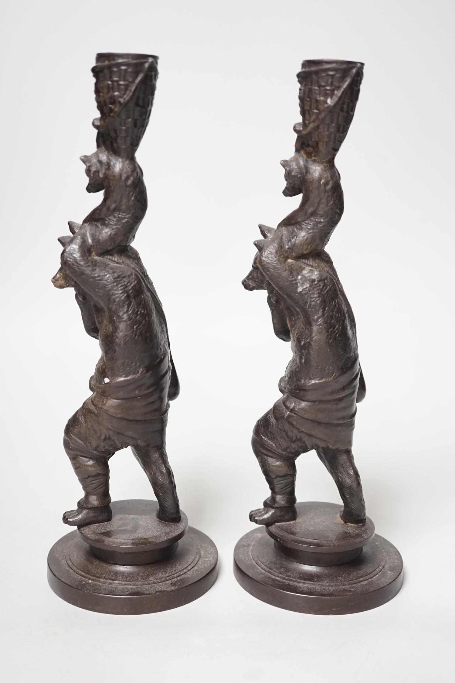 A pair of cast iron candlesticks in the form of anthropomorphised foxes and cubs. 27cm tall - Image 3 of 3