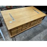 A contemporary Laura Ashley Garrat oak hinged top 12 drawer storage coffee table, length 118cm,