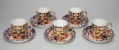 Five Royal Crown Derby Imari coffee cans and saucers