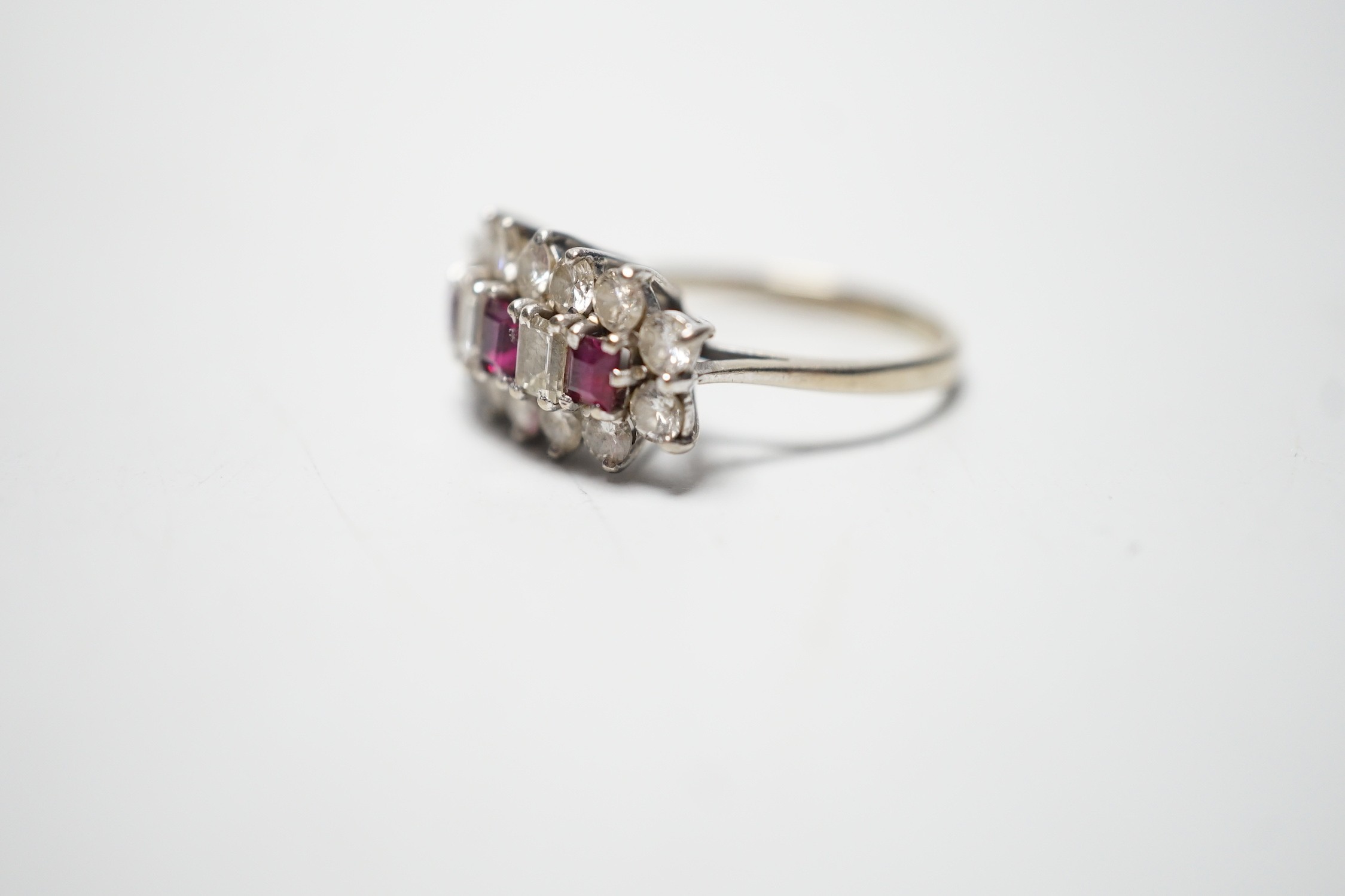 A modern 18ct white gold, square cut ruby and round and baguette cut diamond set cluster ring, - Image 2 of 4