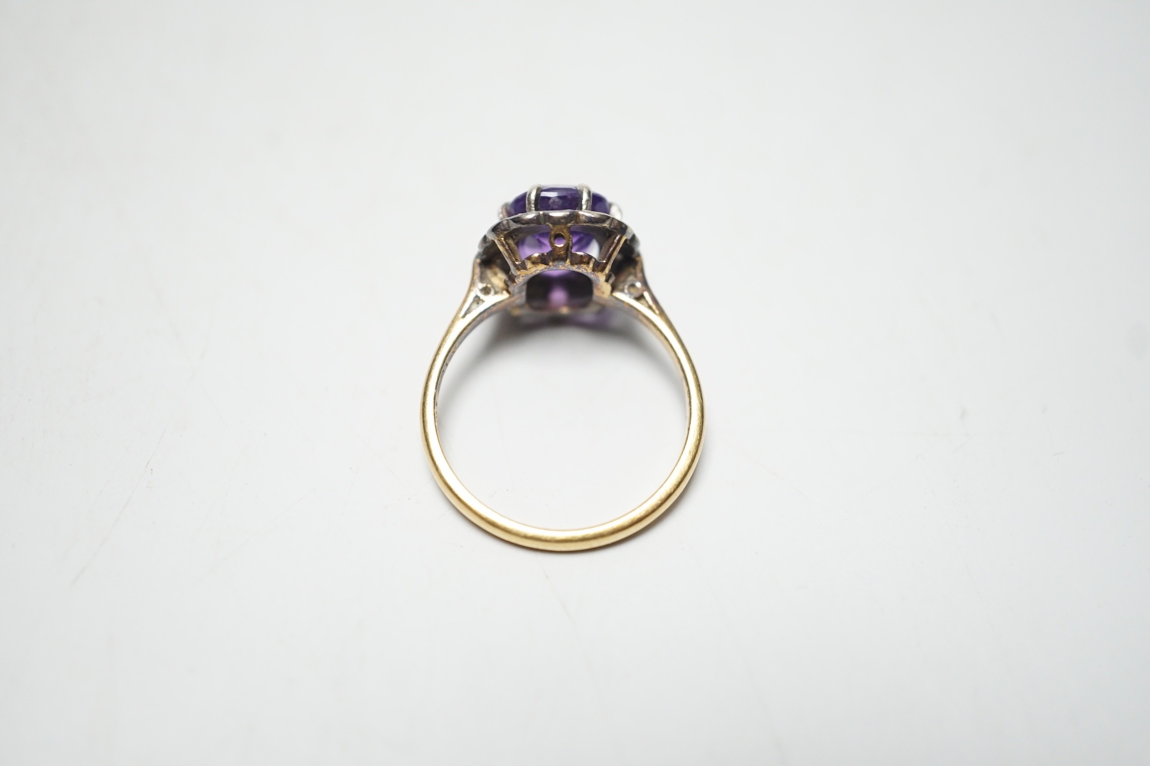 An 18ct, amethyst and diamond set oval cluster ring, size P, gross weight 4.5 grams. - Image 4 of 4