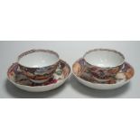 A pair of late 18th century Chinese export famille rose tea bowls and saucers. Saucers 13.5cm