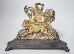 A victorian brass lion group doorstop on cast iron base, 27.5cm wide
