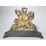 A victorian brass lion group doorstop on cast iron base, 27.5cm wide