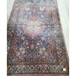 A pair of early 20th century Kashan blue ground rugs, 200 x 128cm (worn)