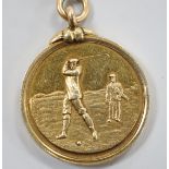 An Edwardian 15ct gold golfing medal, engraved 'Berwick Golf Club, 1902, Captn Prize R.R. Riddell
