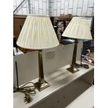A pair of contemporary brass effect table lamps and shades, height including shades, 58cm