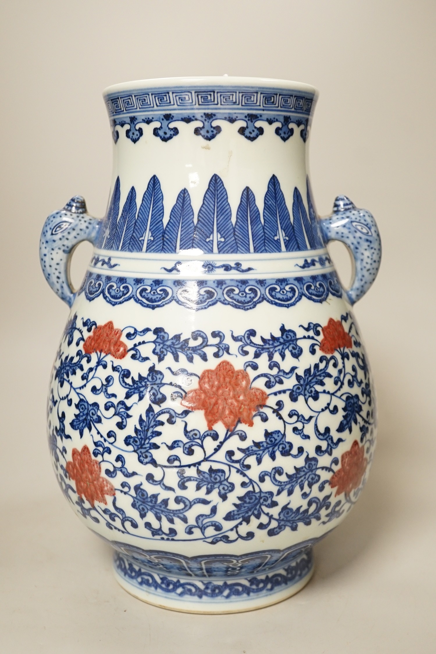 A Chinese underglaze blue and copper red two-handled vase. 31cm tall