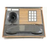 A Deco-Tel personal telephone set in hinged case