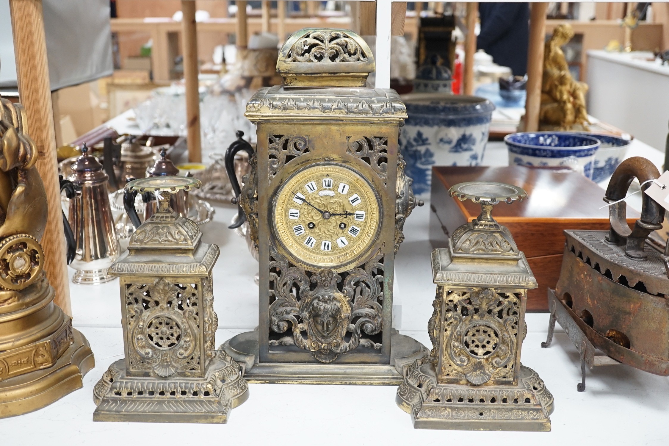 A French brass clock garniture, Comptoir General, 9 Bd Poissenniere, Paris, Matson H. Riondet on