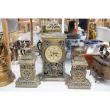 A French brass clock garniture, Comptoir General, 9 Bd Poissenniere, Paris, Matson H. Riondet on