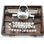 A Blickensderfer typewriter in fitted wooden case