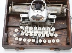 A Blickensderfer typewriter in fitted wooden case