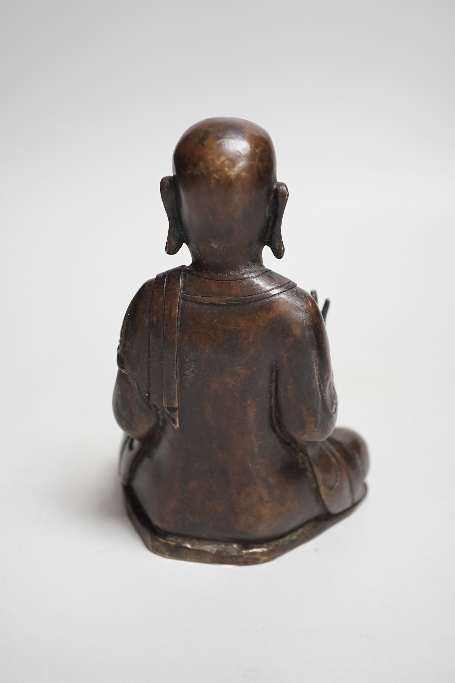 A Nepalese bronze figure of a seated immortal, probably 17th / 18th century, 16cm - Image 3 of 5