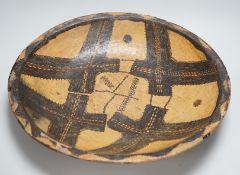 A Berber Kabyle painted clay dish with geometric stitching design, 42.5cm
