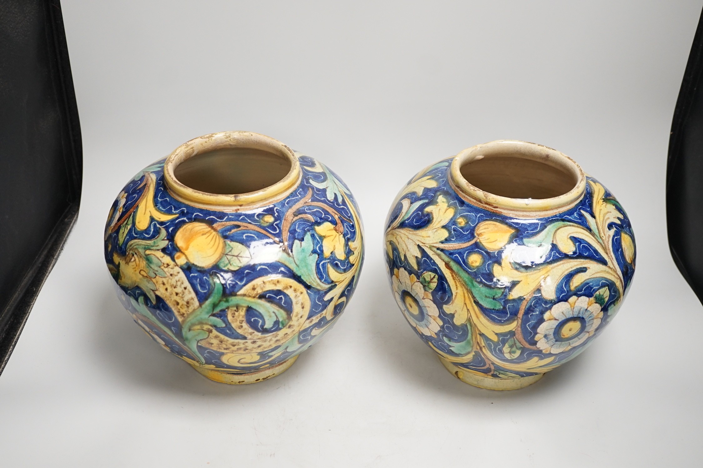 A pair of Italian maiolica flower and fruit painted jars, 22cm tall - Image 2 of 3