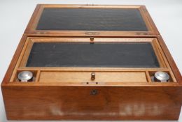 An inlaid mahogany writing slope with two silver-mounted inkwells, 39cm wide