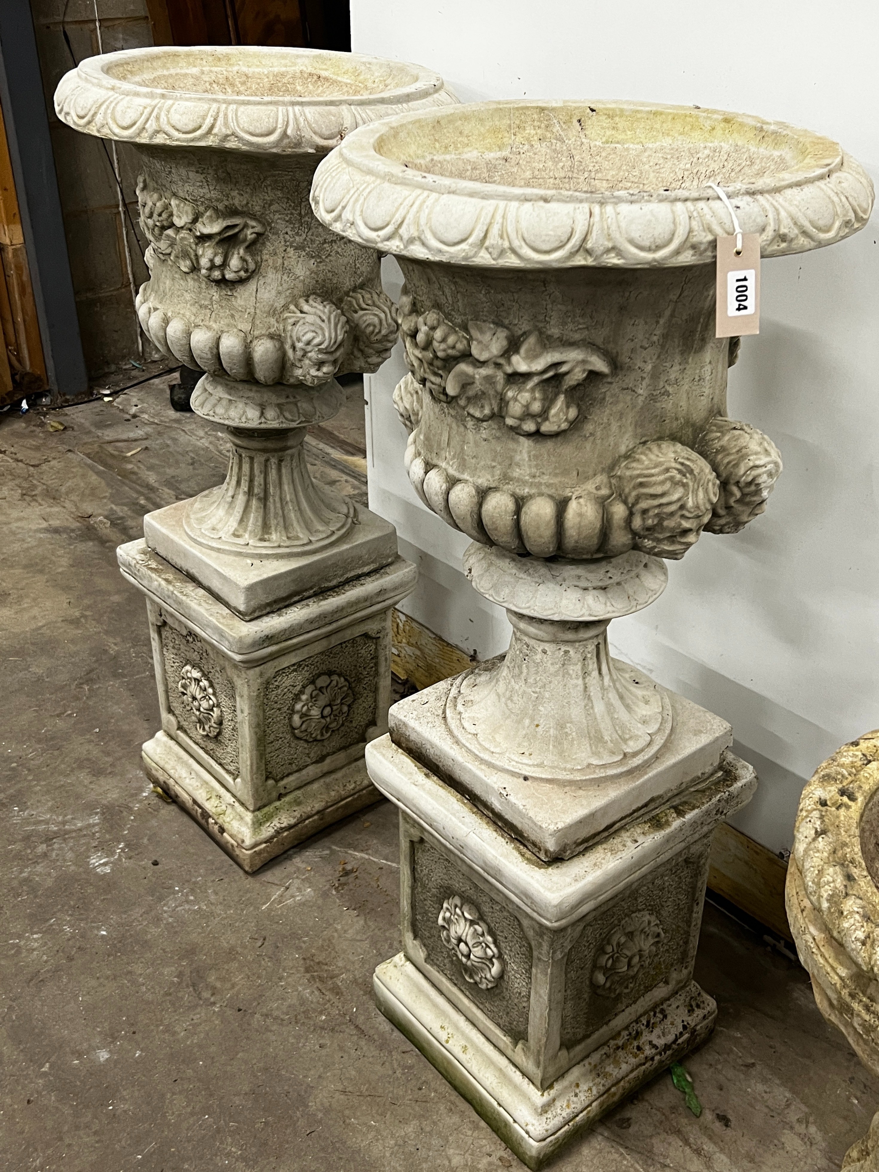 A pair of reconstituted stone campana garden urns on square pedestals, diameter 49cm, height 108cm - Image 2 of 2