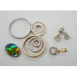 Two small circular 18k and diamond chip set pendants, largest 19mm, one other 18k and solitaire