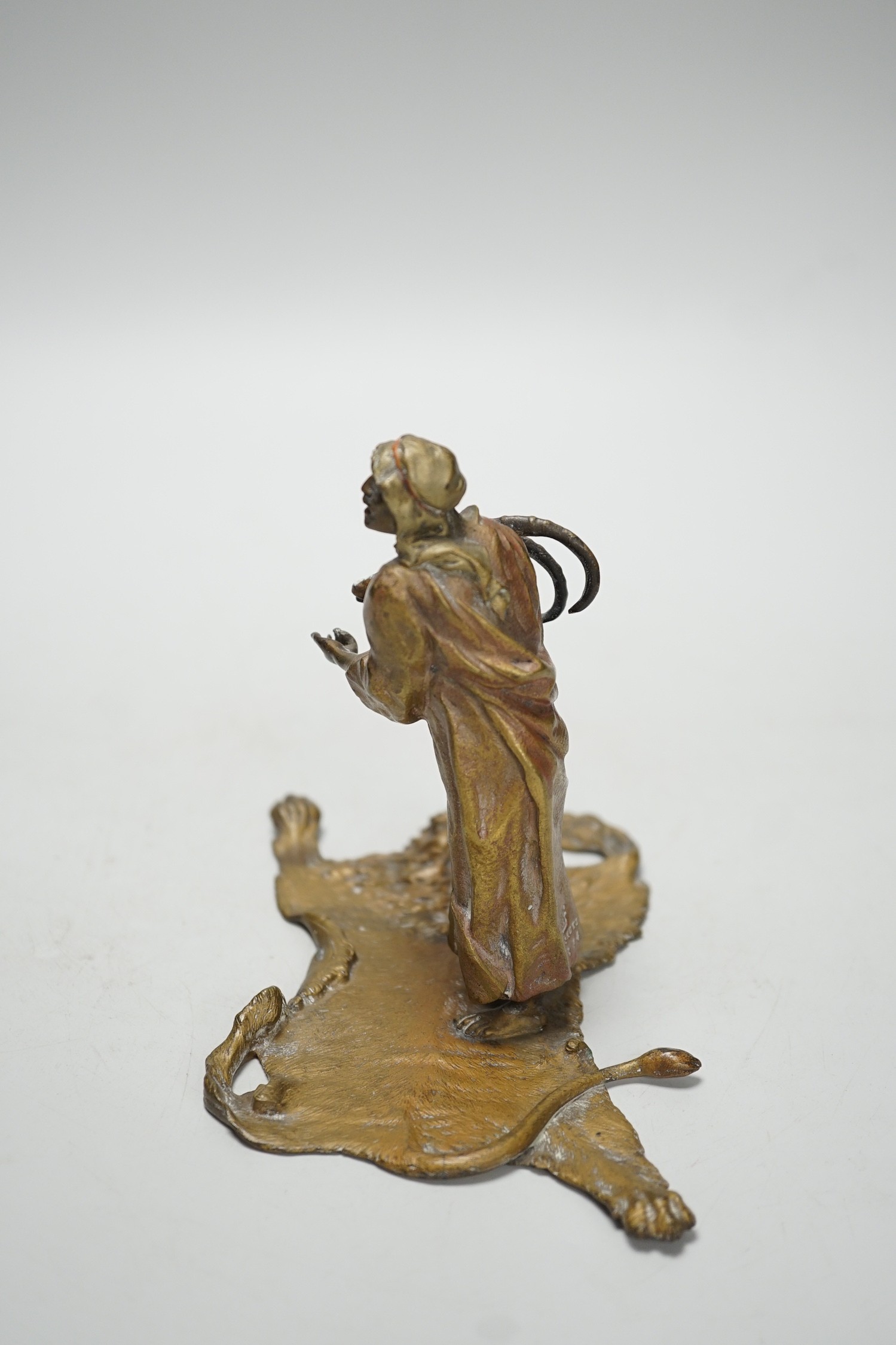 An Austrian cold painted bronze model of a Bedouin trader, depicted holding an Ibex head, standing - Image 3 of 5