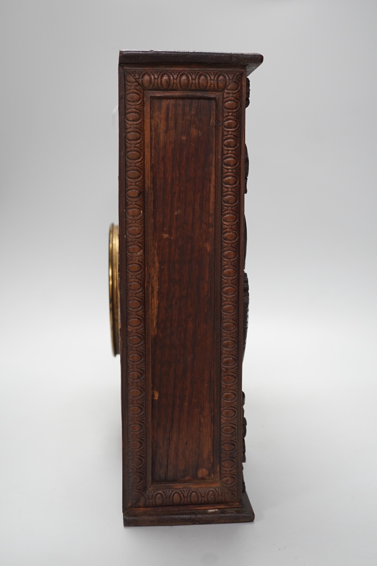 A late 19th century / early 20th century folk art carved oak cased clock, decorated with hanging - Image 5 of 7