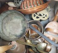 A quantity of various copper and brass to include jelly moulds, trivets, watering cans etc.