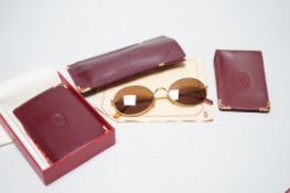 Cartier sunglasses, address book and card case