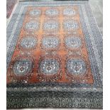 A North West Persian rug, woven rows of circular floral motifs, 270 x 184cm