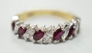 A modern 18ct gold and eleven stone marquise cut ruby and diamond set half hoop ring, size L,